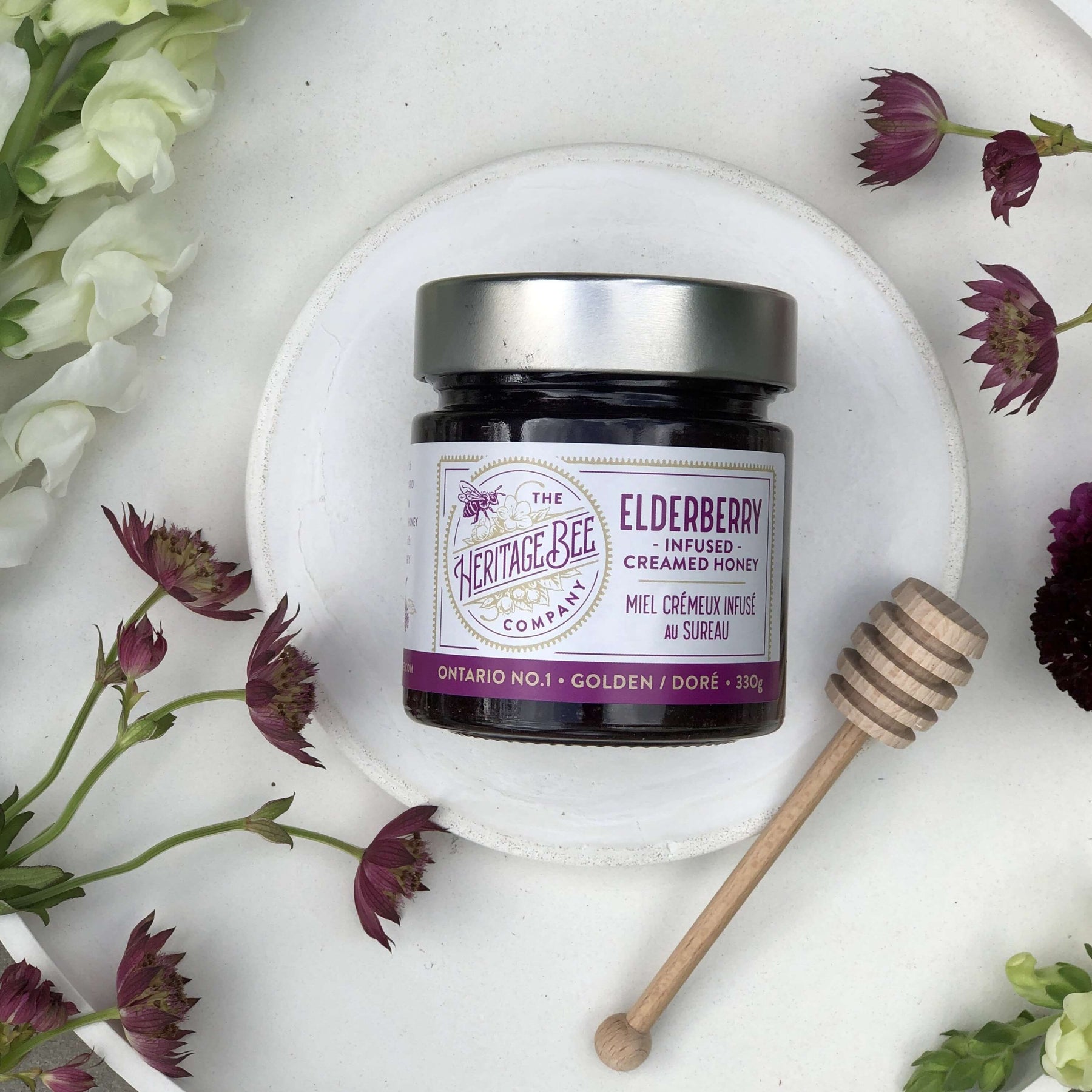 Handcrafted 100% Ontario elderberry infused creamed honey. The elderberry plant can boost immune system, mitigate inflammation, lessen stress, and protect the heart. Can be used as a jam alternative.